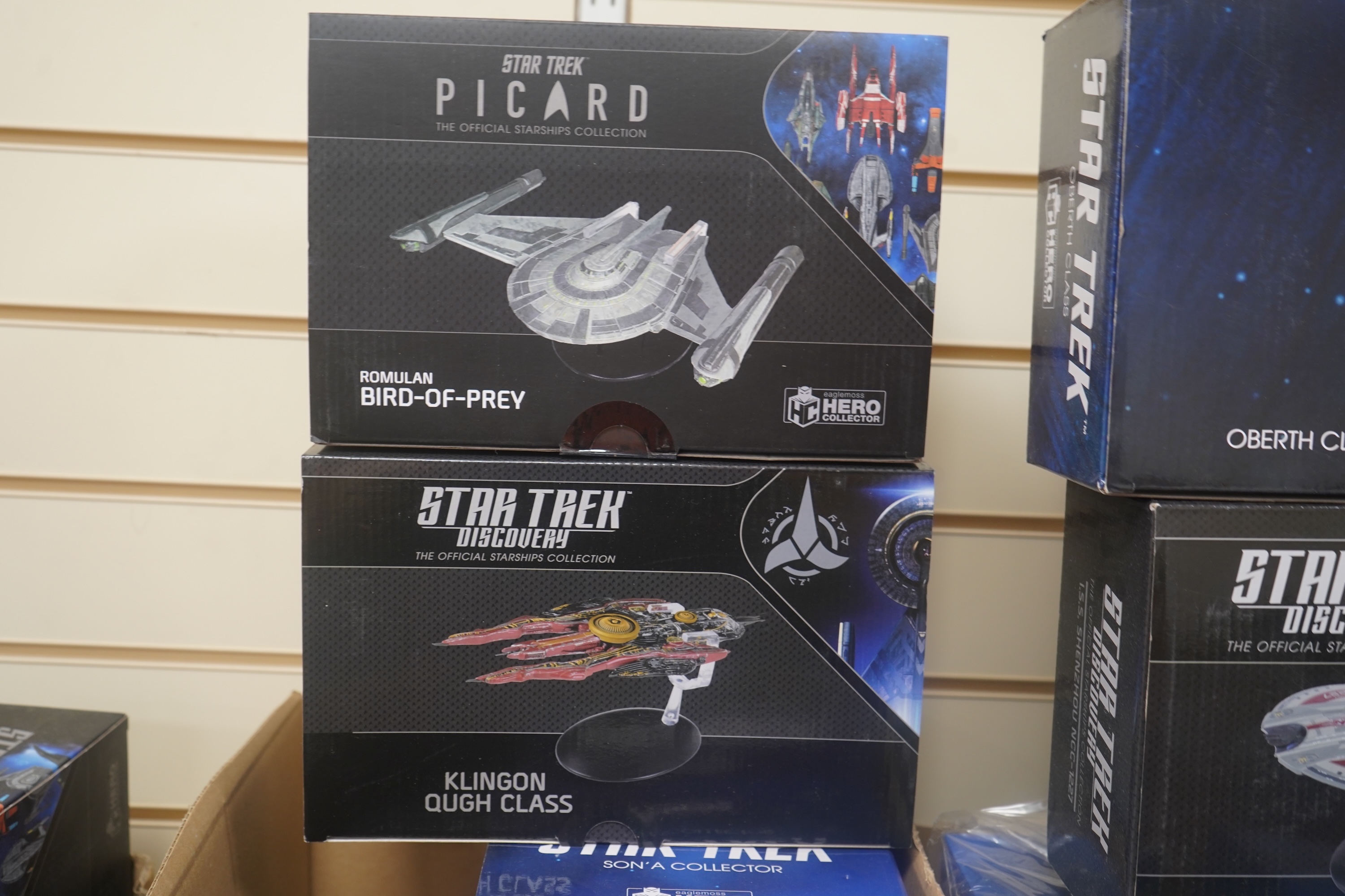 Nineteen boxed Eaglemoss Star Trek magazine issue models, including; a Vulcan Cruiser, a Klingon Qugh Class vessel, a Son’a Battleship, a Romulan Flagship, Jupiter Station, Ty’Gokor Orbital Station, etc. Condition - good